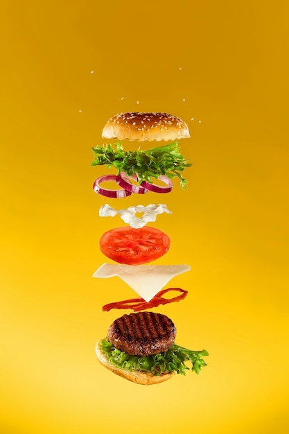 Premium Photo | Photo delicious grilled beef burger with flying ...