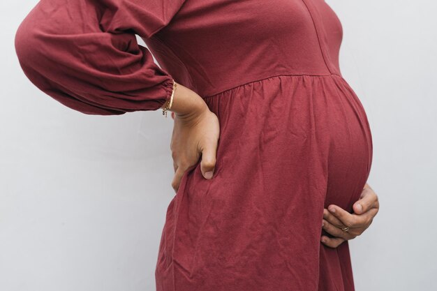 Premium Photo | Portrait muslim pregnant woman holding her belly stomach