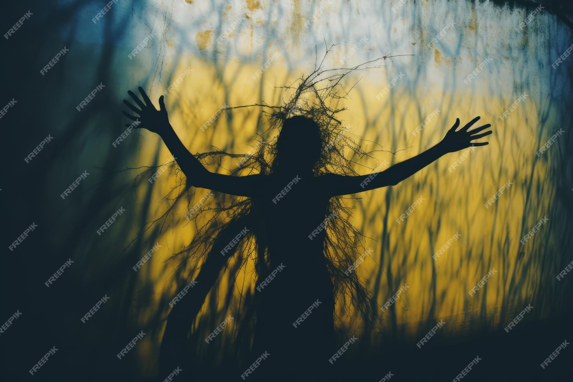 Premium Photo | A silhouette of a person standing in front of a tree