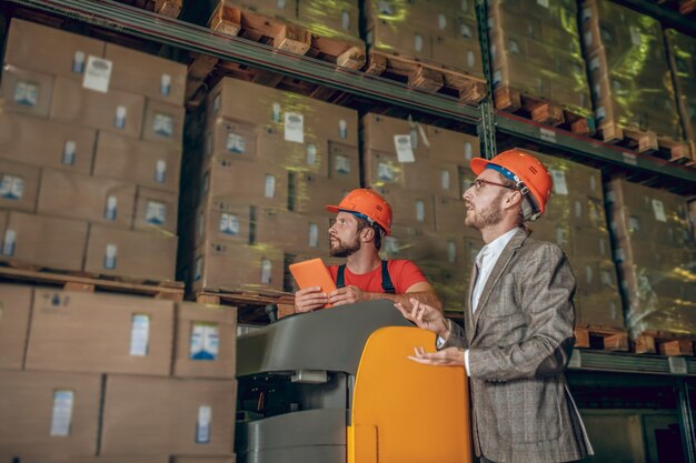 Premium Photo | Warehouse worker with helmet