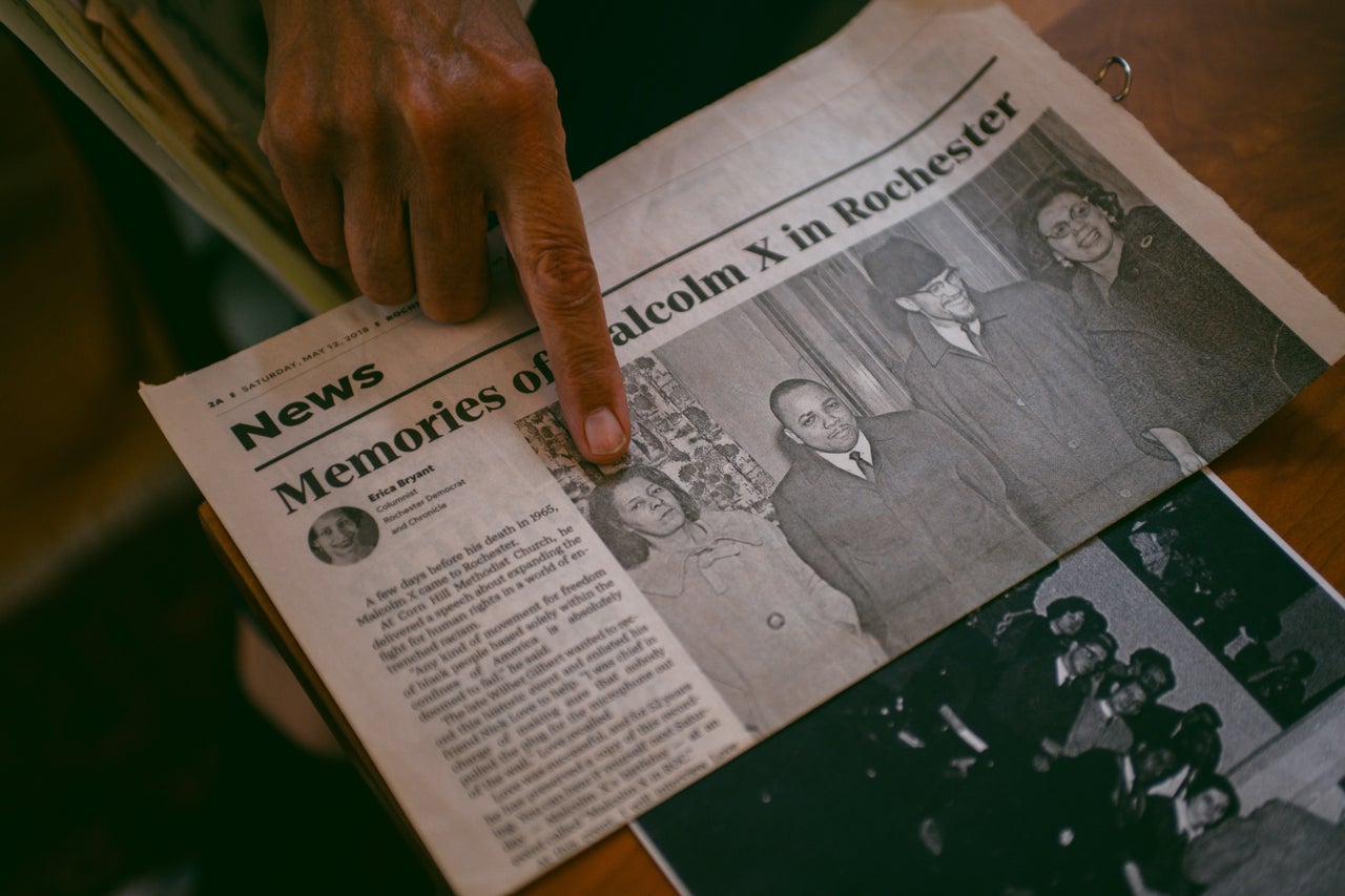 Sondra Price points to her mother, Doris Price, in a photo with Franklin Florence, Malcolm X and Constance Mitchell.