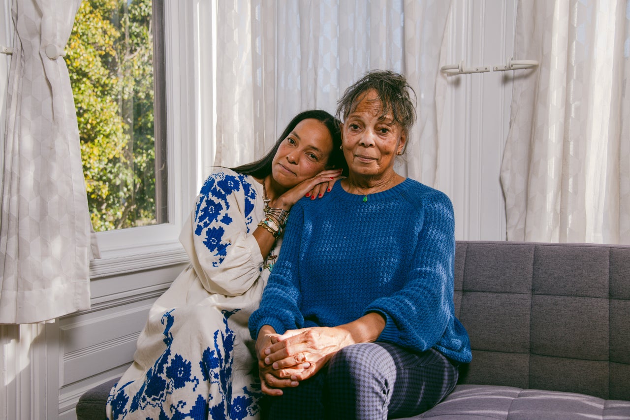 Kay Washington, left, and her mother Sondra Price sit for a portrait at home in San Francisco. Price and Washington are the descendants of Doris Price, a Black Panther leader and pioneering bookstore owner from Rochester, NY, who was omitted from a mural depicting Malcolm X and other Black activists from the area.