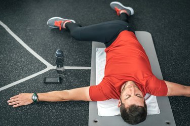 Man doing back stretches to help with his back pain