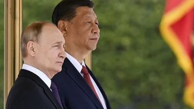 Putin backs China over Taiwan and dismisses fears about military cooperation