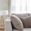 Light colored couch in a living room.