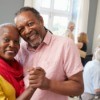 Couple dancing and posing at a party.