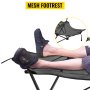 feet resting on a VEVOR folding camp chair with a mesh footrest.