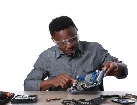 African-American technician repairing computer on white background