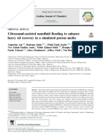 Ultrasound-Assisted Nanofluid Flooding To Enhance Heavy Oil Recovery in A Simulated Porous Media