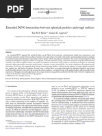 Extended DLVO Interactions Between Spherical Particles and Rough Surfaces