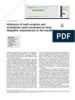 Hindrance of Tooth Eruption and Orthodontic Tooth Movement by Focal Idiopathic Osteosclerosis in The Mandible