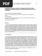 Numerical Simulation of Turbulent Flow Over Surface Mounted Obstacles With Sharp Edges and Corners