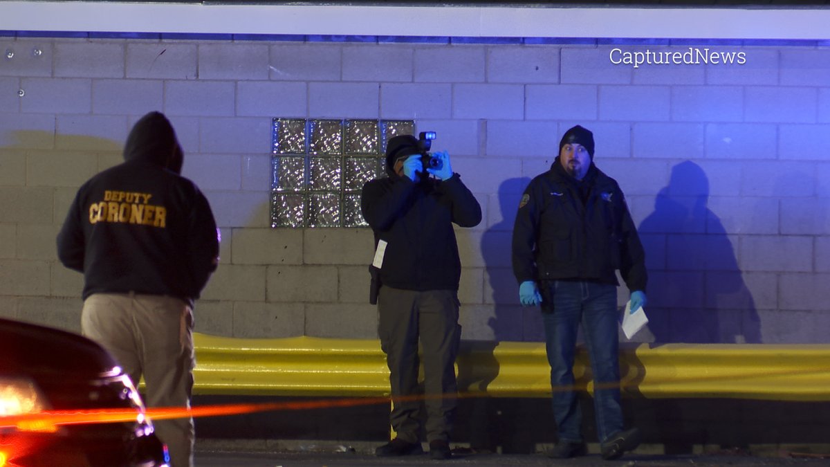 EAST CHICAGO, IN: Coroner on scene at a BP gas station near 145TH & Indianapolis Blvd Sunday evening. Crime scene tape stretched around the business.