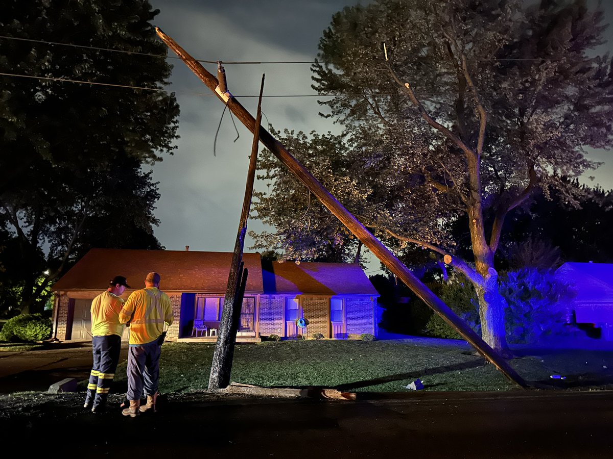 Car on tow truck on S. Sherman Dr. after catching on fire. Utility pole knocked over.