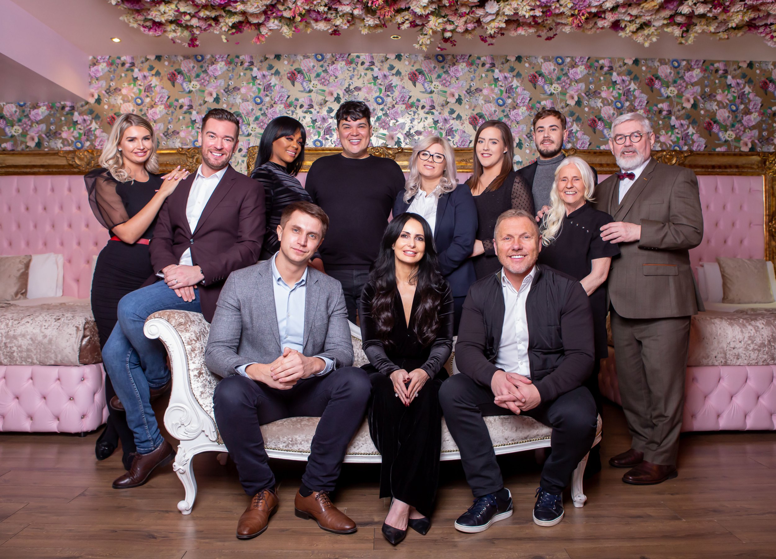 Programme Name: The Grand Party Hotel - TX: n/a - Episode: n/a (No. Early Release) - Picture Shows: L-R standing - Fearne Barrie (Receptionist), Damian (General Manager), Kemi (Guest Experience manager), Liam (Guest Relations), Mel (Events Manager), Ciara (Wedding Co-ordinator), James (Trainee Guest Relations Manager), June (cleaner), Eric (doorman) L-R seated Kris (Senior Director), Katie (Owner) and Lawrence (Owner) - (C) Spun Gold TV - Photographer: Diane Thompson