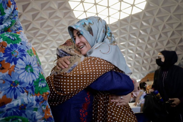 Two women from the Muslim community embrace inside Mexico City's Plan SEXENAL Sports Center as they line up to share food during the celebration of Eid al-Adha (Feast of Sacrifice), which originates from the moment when God appeared in a dream to Abraham, known as Ibrahim to Muslims, and asked him to sacrifice his son to demonstrate his loyalty. According to the Koran, the holy religious book of Islam, just as Ibrahim was about to sacrifice his son, God replaced Ismail with a lamb, which was sacrificed in his place. (Photo by Gerardo Vieyra/NurPhoto via Getty Images)