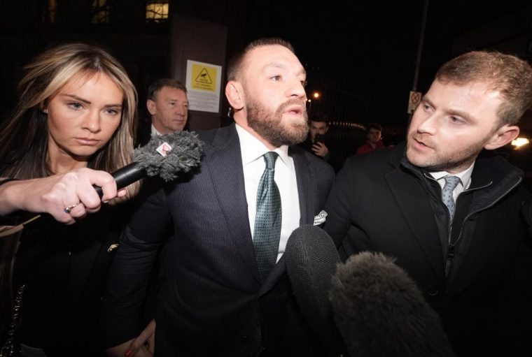 Mixed martial arts fighter Conor McGregor (centre) and partner Dee Devlin leave the High Court in Dublin after the personal injury case against him. Nikita Hand, who is also known as Nikita Ni Laimhin, alleges she was raped by McGregor in a Dublin hotel in December 2018. After deliberating for six hours and 10 minutes, the jury returned with their verdicts in the civil trial against Conor McGregor. The total amount of damages awarded to Nikita Hand by the jury was 248,603.60 euro. Picture date: Friday November 22, 2024. PA Photo. See PA story IRISH McGregor. Photo credit should read: Brian Lawless/PA Wire