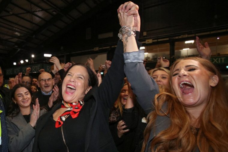 Irish republican and pro-Irish unity party Sinn Fein's party leader Mary Lou McDonald (L) celebrates with party colleagues after being elected in Dublin Central at the Dublin RDS count centre, in Dublin, on November 30, 2024. Sinn Fein's leader Mary Lou McDonald, 55, told reporters in Dublin that her party has been given "a powerful and strong mandate" in the election. (Photo by Paul Faith / AFP) (Photo by PAUL FAITH/AFP via Getty Images)