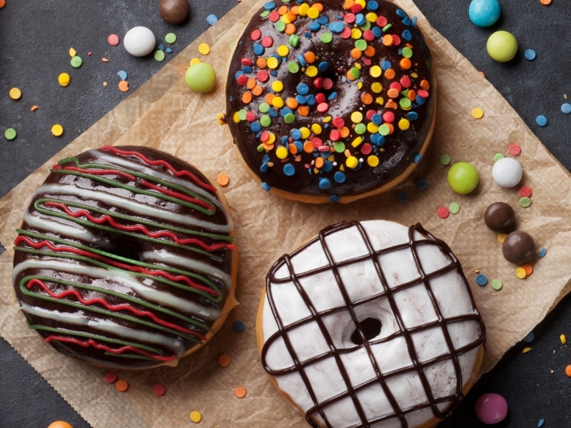 Mix Flavored Donuts on a Parchment Paper