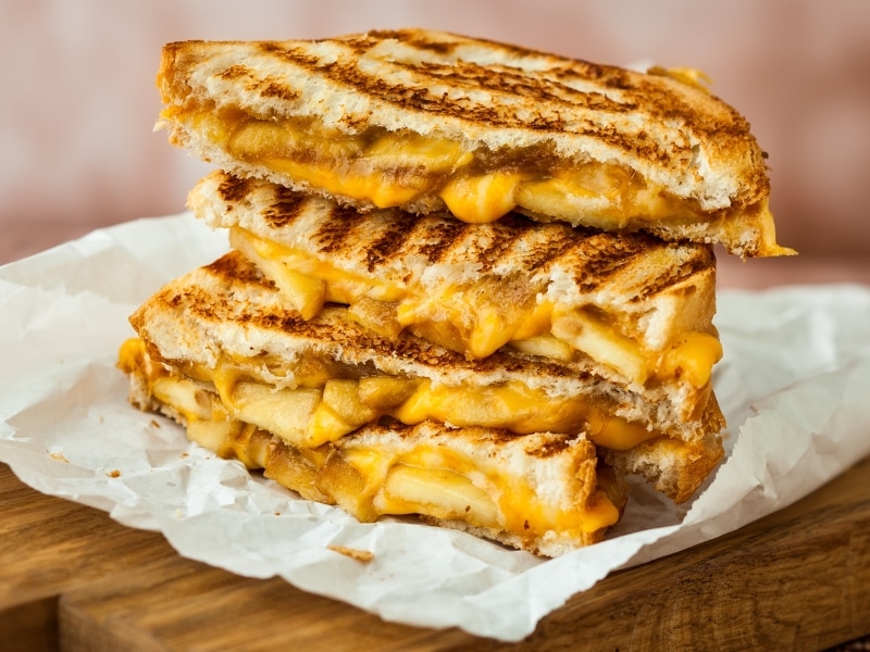 Grilled cheese stack on a pieces of parchment paper