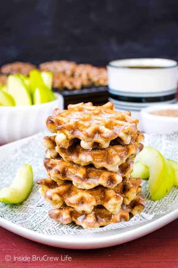 Mini Apple Fritter Waffle Donuts - shredded apples and a sweet glaze make these little waffle donuts a delicious snack. Make this easy fall recipe for breakfast or an afternoon snack. #apple #waffles #donuts #applefritters #fallsnacks #breakfast #afterschoolsnack #waffledonuts #crunchpak