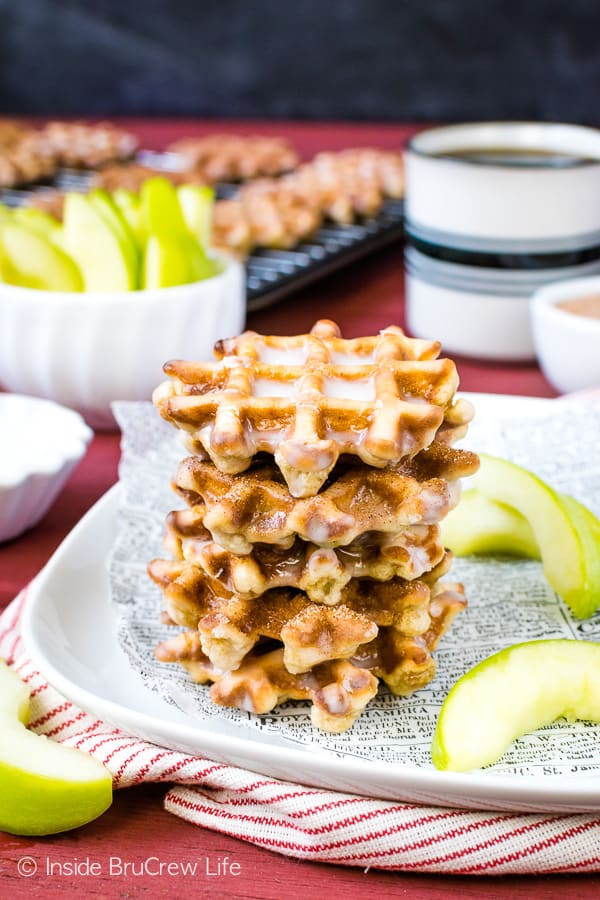 Mini Apple Fritter Waffle Donuts - these little waffle donuts are loaded with apples and dunked in a sweet glaze. Perfect little treat for after school snacks or breakfast this fall. #apple #waffles #donuts #applefritters #fallsnacks #breakfast #afterschoolsnack #waffledonuts #crunchpak