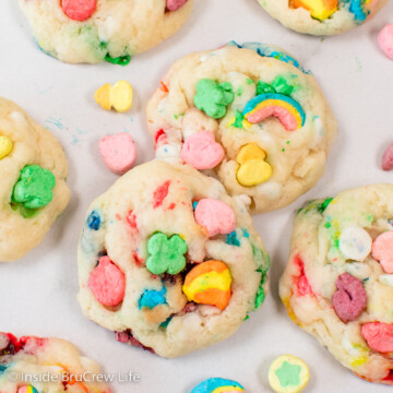 A white board with Lucky Charms cookies lying on it.