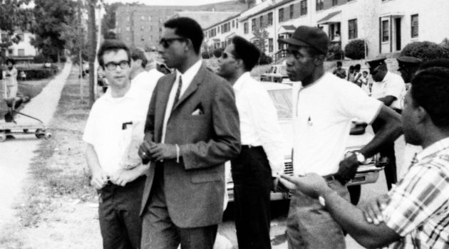 Black Power activist Stokely Carmichael, (2nd from left), visiting Barry Farm Dwellings in 1967 with community organizers from the Southeast Neighborhood House, including Phil Perkins (far left). (Image courtesy Anacostia Community Museum Archives, Smithsonian Institution