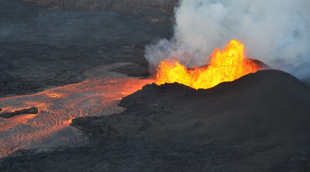 Lava fountaining continues at a fissure from Kilauea in this photo taken on June 5, 2018. The fountain has built a 115-foot high cone, and an actively-growing spatter rampart on its eastern side. The lava channel leading from the cone is full to its banks. (USGS image)