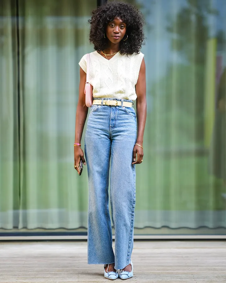 style your sweater vest tucked into jeans