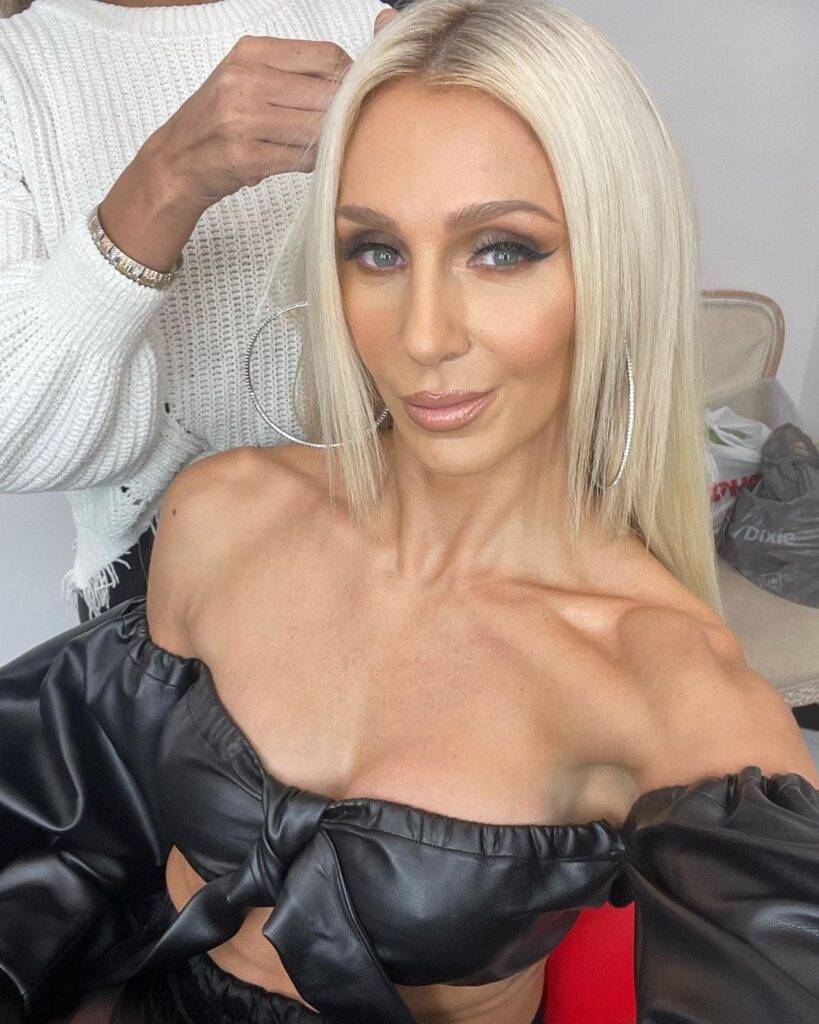 Charlotte Flair is Wearing black dress or looking hot and taking selfie