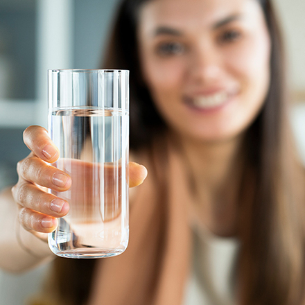 lady holding a glass of water