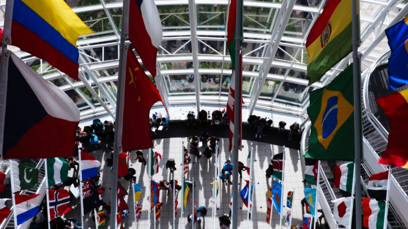 International flags hanging in Strong Hall on Missouri State University campus