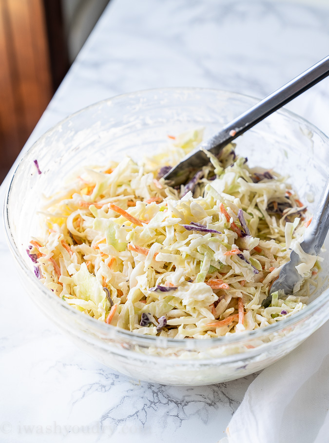 Mix together the coleslaw mix with mayo, apple cider vinegar and sugar in a large bowl.