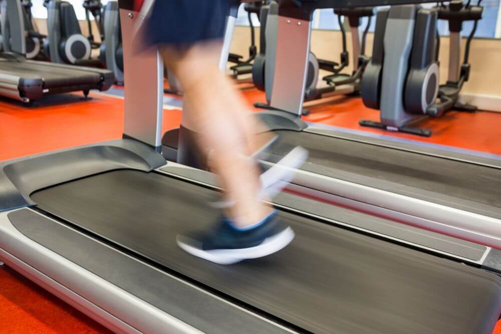 A runner on a treadmill with an incline