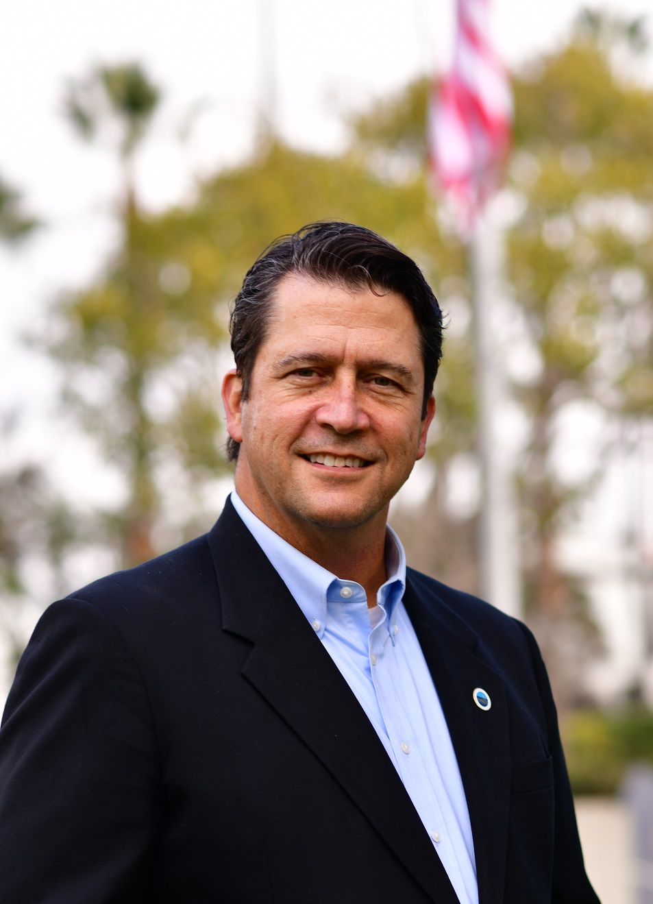 Campaign Headshot with Flag