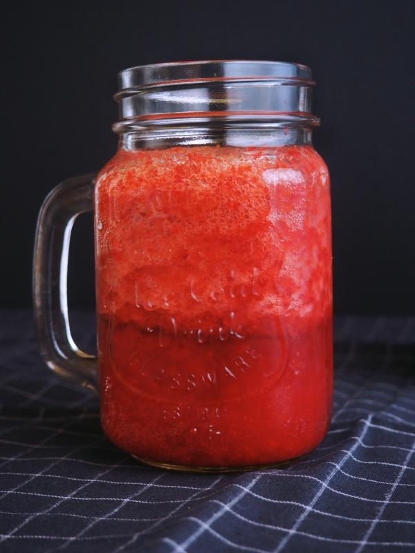 Clear Glass Mason Mug Filled With Red Liquid