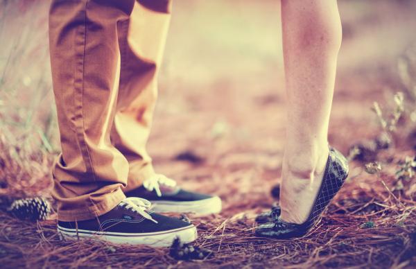 Close-Up of Lovers Legs in the Forest