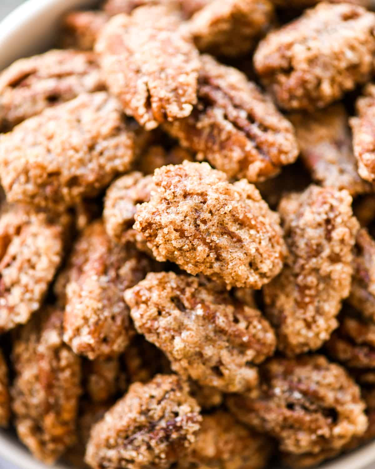 up close overhead view of homemade Cinnamon Sugar Pecans in a bowl