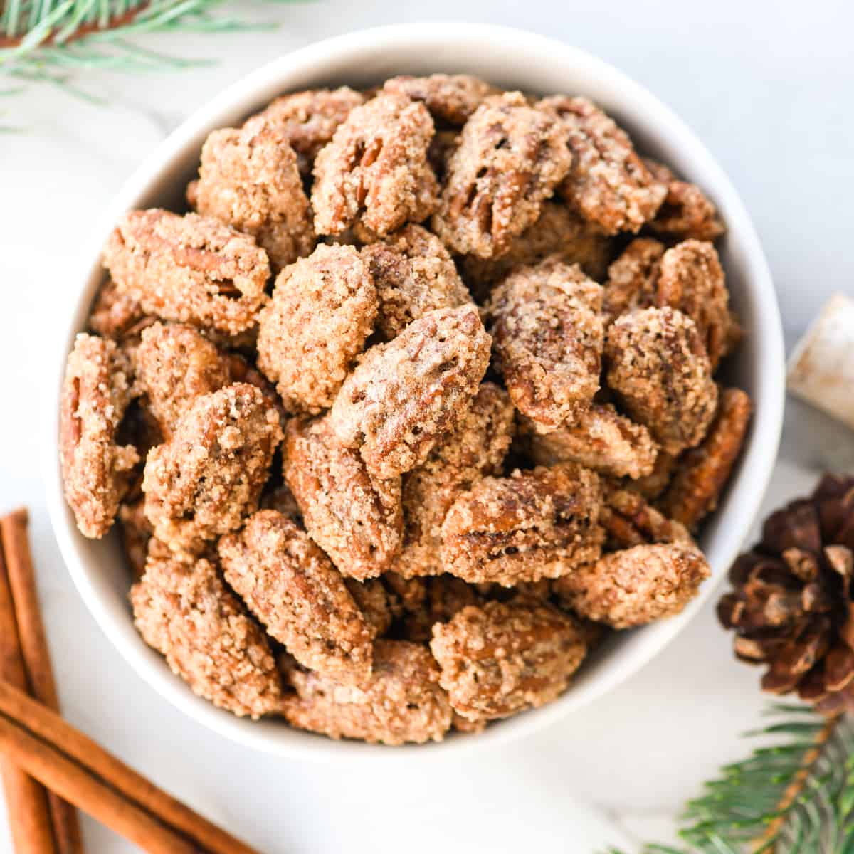 a bowl of candied pecans 