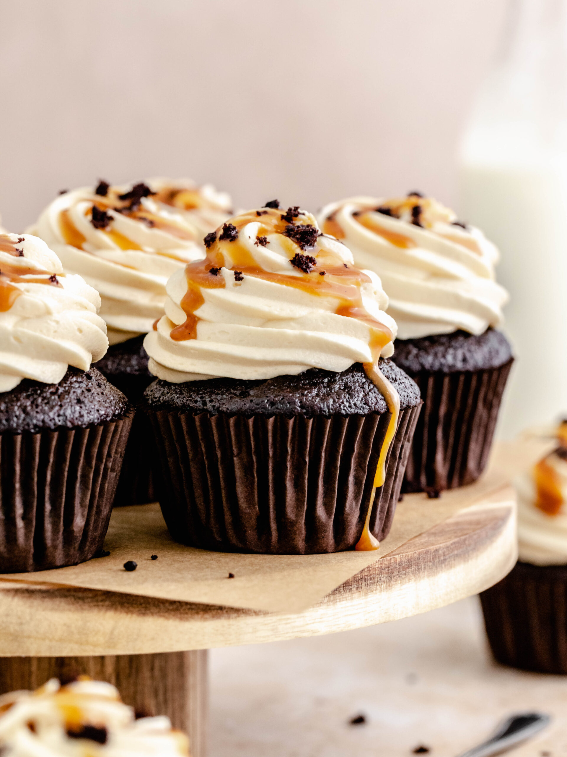 caramel filled cupcakes on a cake stand.