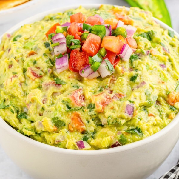 jalapeno gucamole in a white serving bowl