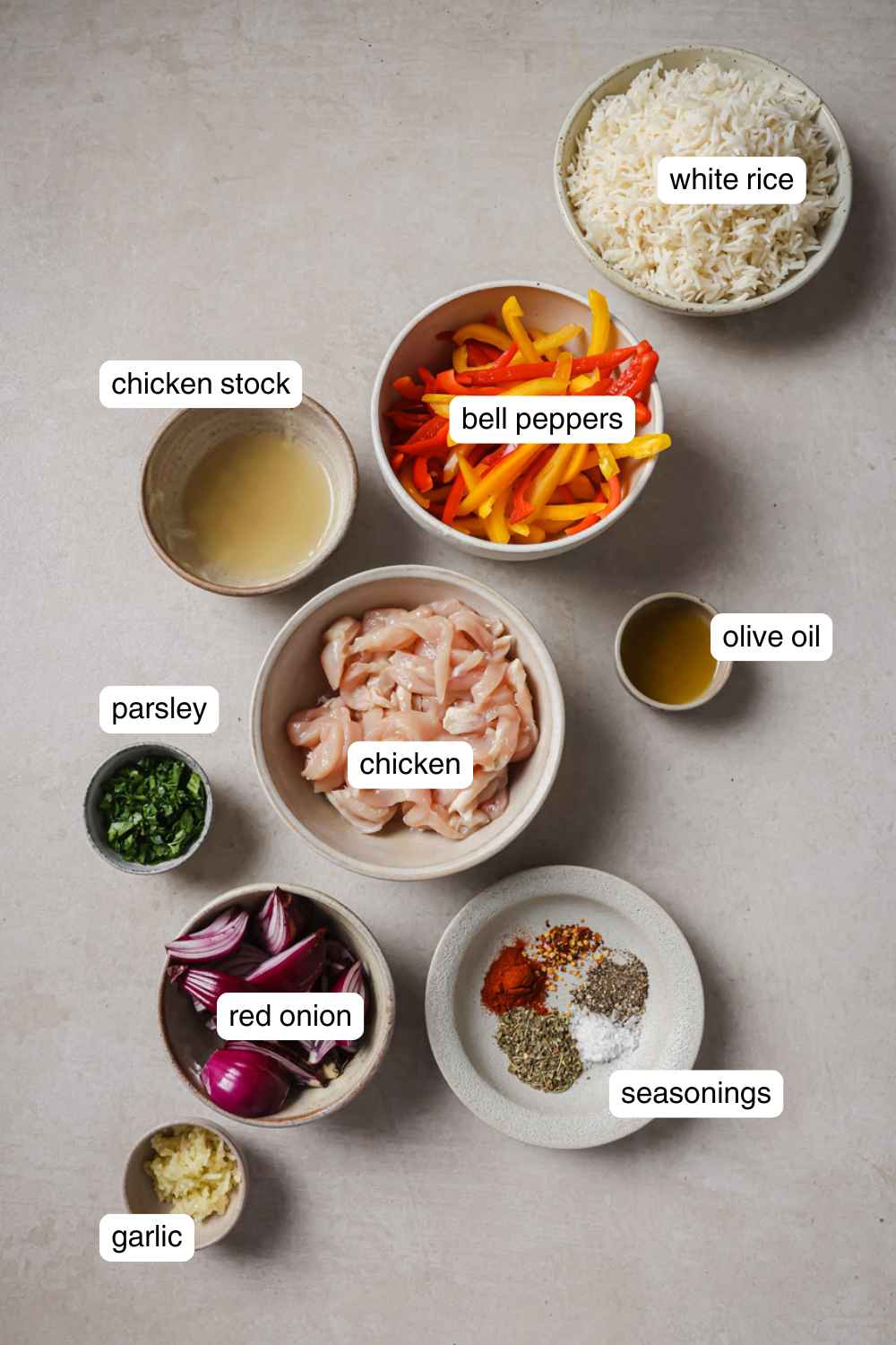 Labeled ingredients for baked chicken and peppers.