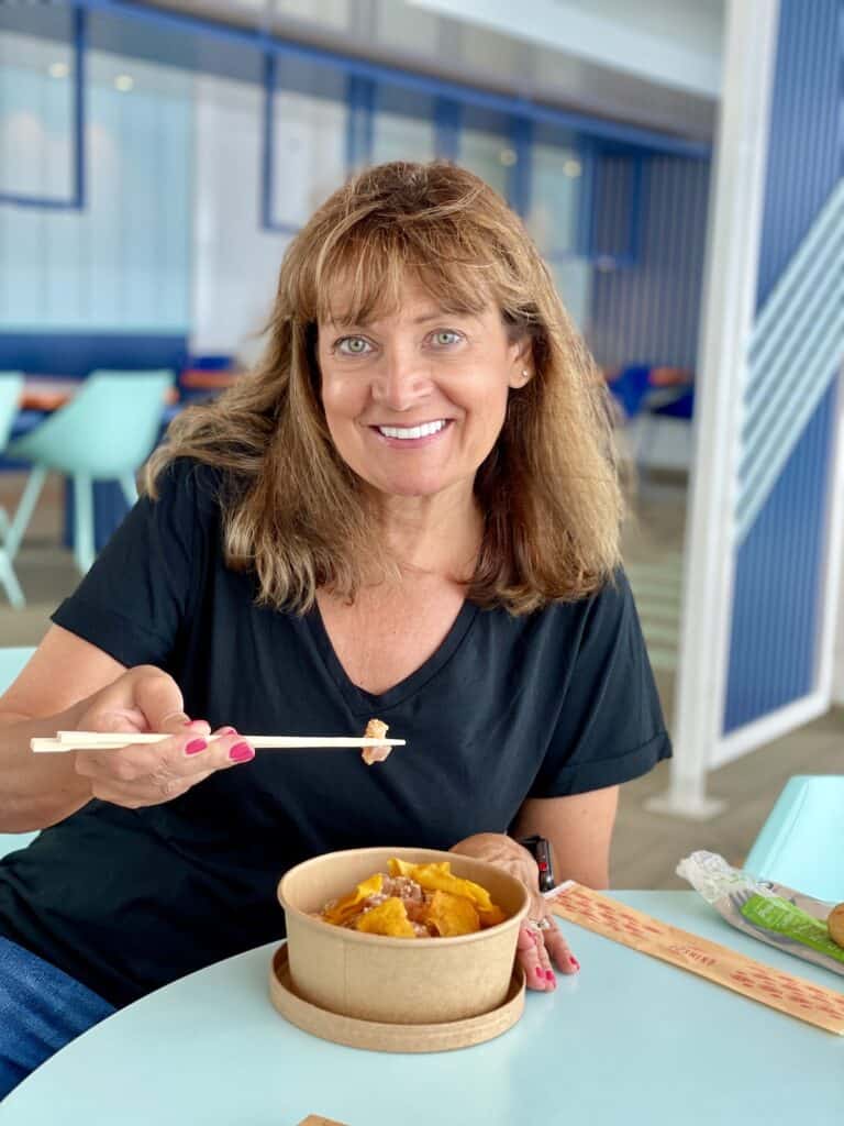 Kelly eating a Poke bowl on Costa Cruise.