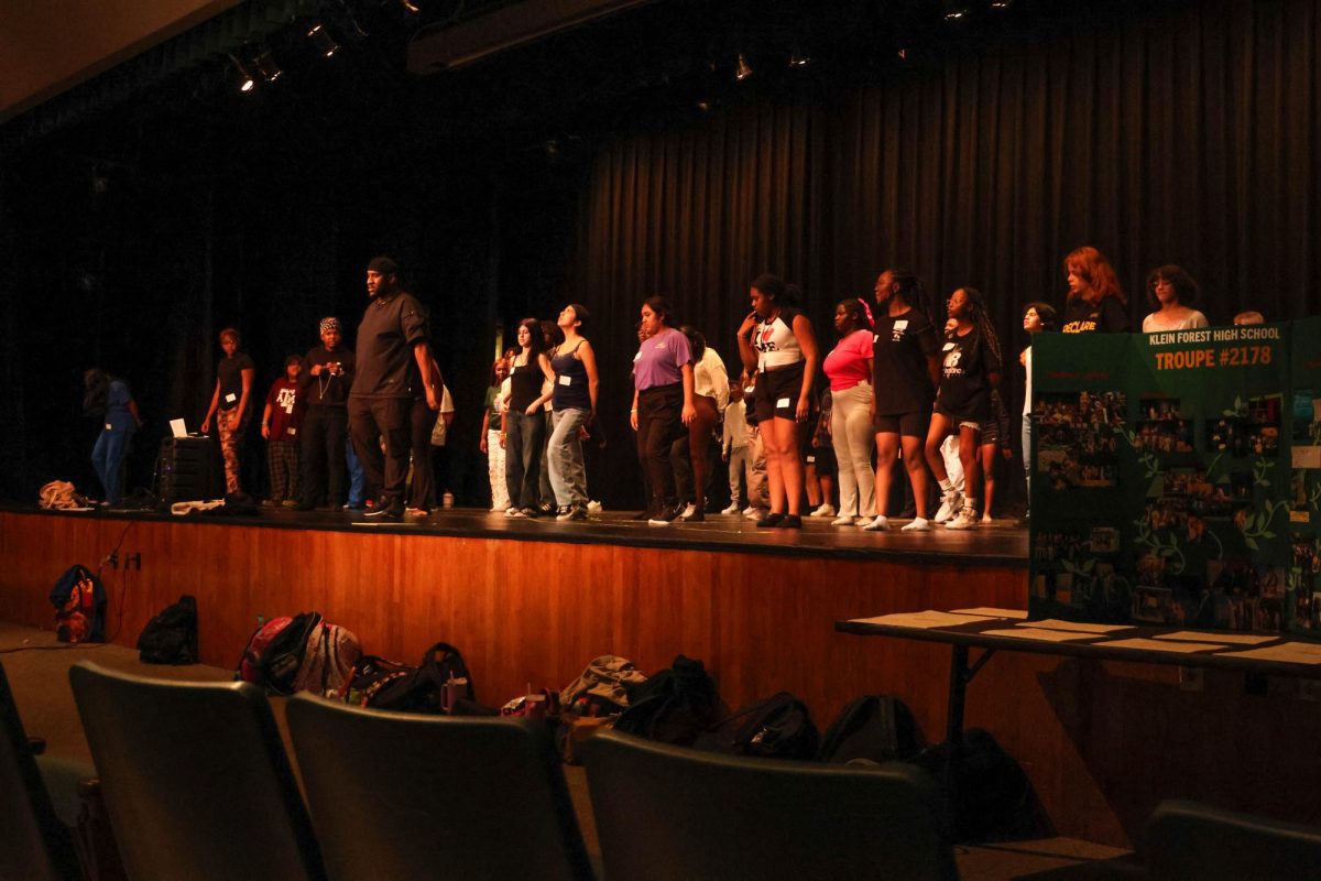 Theater director Randryck Lewis teaches students the cheorography to "We're All In This Together" for the "High School Musical" auditions.