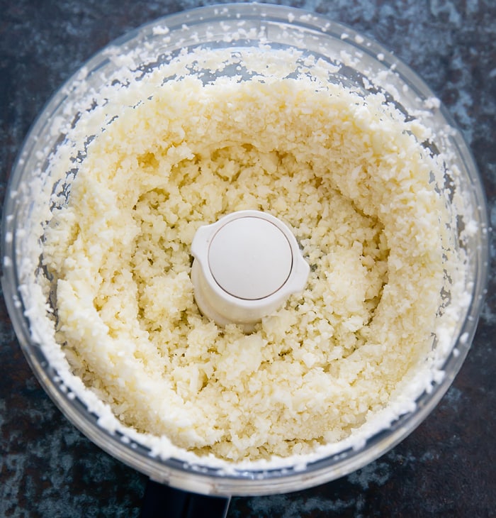 process photo showing how to finely chop the cauliflower in a food processor