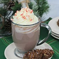 Tall clear mug of boozy peppermint mocha