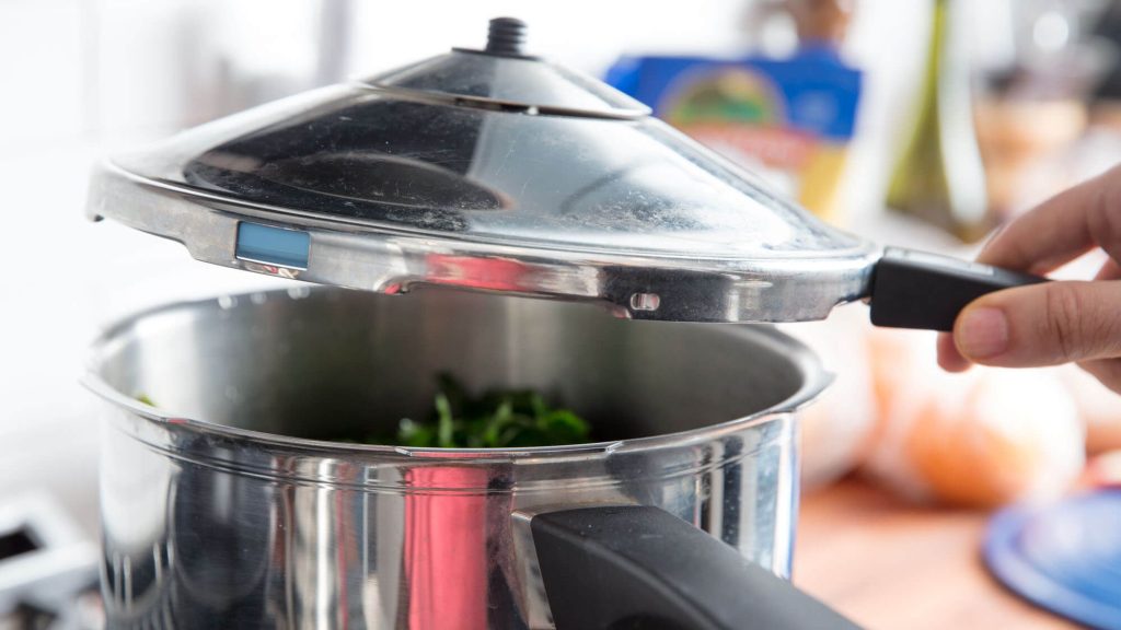 What Is the Process of Using a Pressure Cooker