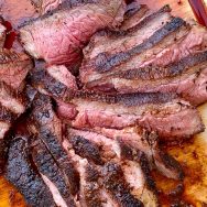 Tri Tip sliced on cutting board