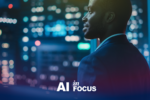 Businessman thinking about the future of AI as he looks hopefully at a cityscape with a text overlay that reads "AI in Focus"